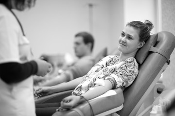 Young beutiful woman in blood donation center