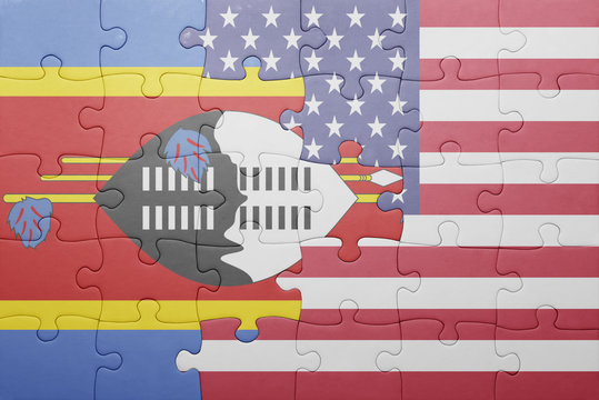 puzzle with the national flag of united states of america and swaziland