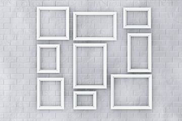 Obraz na płótnie Canvas White Picture Frames on a Brick Wall