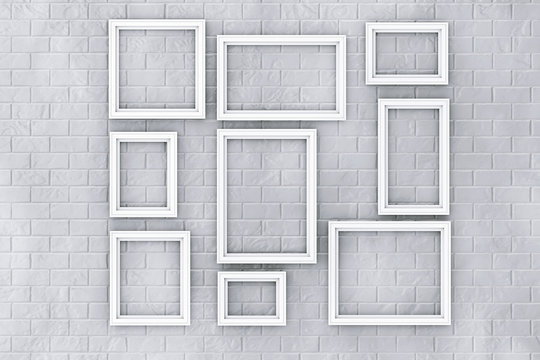 White Picture Frames on a Brick Wall