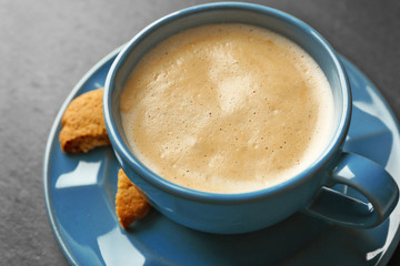Cup of coffee on gray background