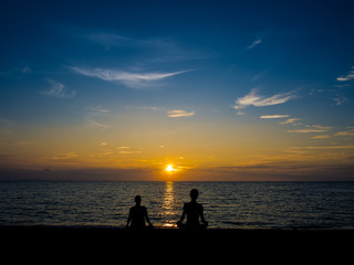 Naklejka na ściany i meble Sunset Meditation on the beach