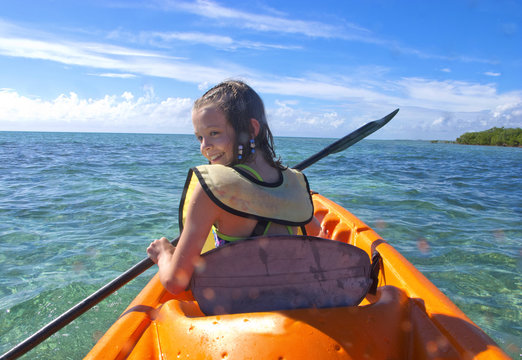 girl kayaking in the caribbean