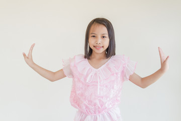 Beautiful little asian kids girl wear pink dresses. Show dance form Thailand.