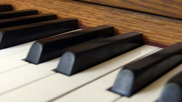 Upright Piano Keyboard Close Up Flyby Over Keys
