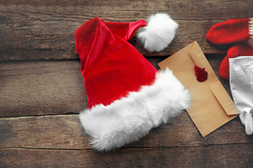 Obraz na płótnie Canvas Santa Claus costume on wooden background, close up