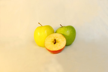 Three apples in different colors