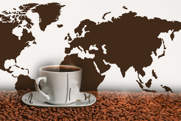 A cup of coffee on the background of the world