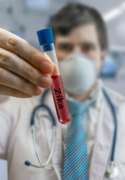 Doctor holds test tube with blood infected with ZIKA virus.