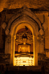 Golden sitting Buddha inside  Ancient Pagoda in Wat Chedi Luang,Chiang Mai city.