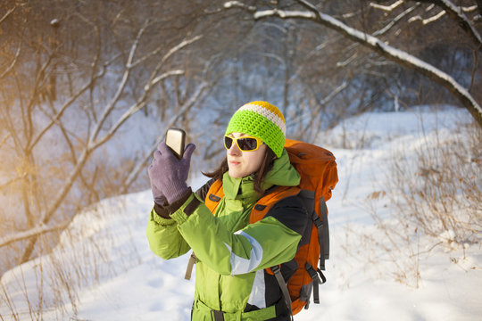 Girl photographs on the phone.