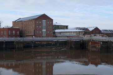 Hull view on coast houses and shipyard
