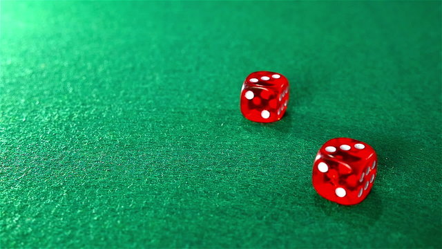 Slow motion of rolling red dice