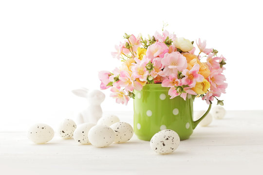 Easter Eggs And Flowers On White Background