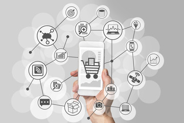 Mobile shopping experience with hand holding smartphone to connect to online shops to purchase...