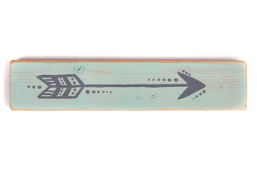 One hand painted arrow on a wooden plank