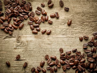 Foto op Plexiglas Coffee beans on wooden table © Mara Zemgaliete