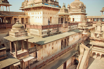 Tourist watching beautiful walls of 17th century fortress Jahangir Mahal