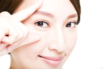 Obraz na płótnie Canvas Closeup shot of young smiling woman eyes makeup