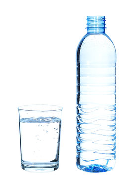 Bottle and glass with water on white background.