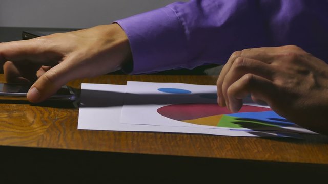 businessman holding chart analyst sales documents