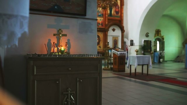 church religion burning candle on the background of the cross with Jesus