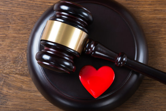 Mallet And Heart On Table In Courtroom