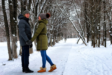 Fototapeta na wymiar couple heterosexual street walk winter