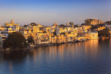 View of Ghats of lake Pichola at sunset. Udaipur, Rajasthan, India