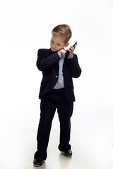 Portrait of a boy in a suit in the studio.