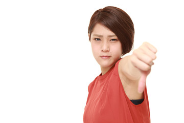 young Japanese woman with thumbs down gesture
