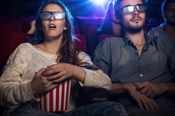 People watching a 3d movie at the cinema - obrazy, fototapety, plakaty