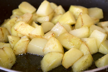 crispy fried potatoes in pan