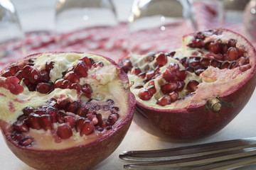 two half of a ripe pomegranate