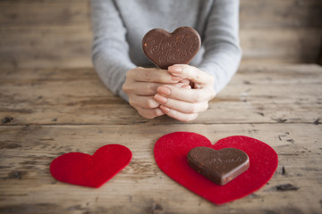 Women who have a heart-shaped chocolate
