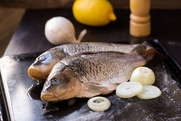 fresh carp fish with spices and lemon