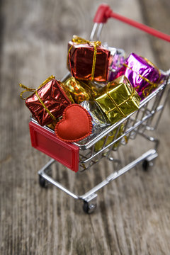 Shopping cart with gifts and heart