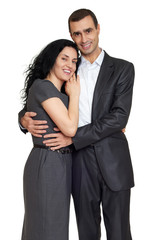 Happy couple dressed in classic clothes, portrait at studio on white