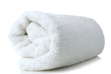 Fototapeta na wymiar soft bath towel rolled up on a white isolated background