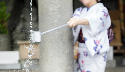 Water purification at entrance of Japanese temple