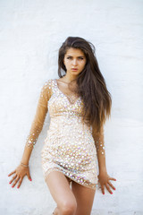 Beautiful young woman in disco dress