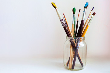paint brushes in jar