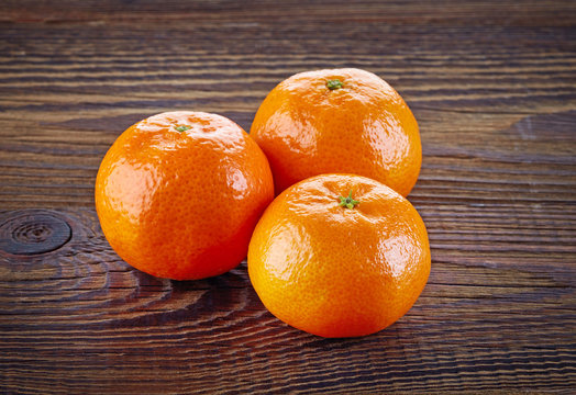 Mandarines or tangerines on wooden table