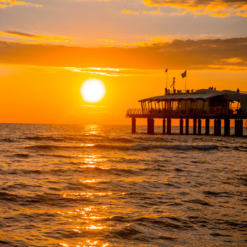 delightful sea sunset/
Stunningly beautiful sunset over the sea in Italy. Photo presents mood, a sense of calm, and the air of freshness.
