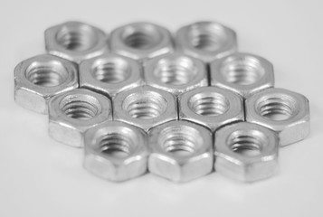 Metallic micro nuts with thread (shallow DOF macro)