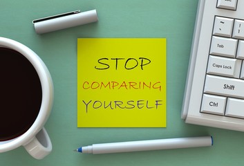 STOP COMPARING YOURSELF, message on note paper, computer and coffee on table © krung99