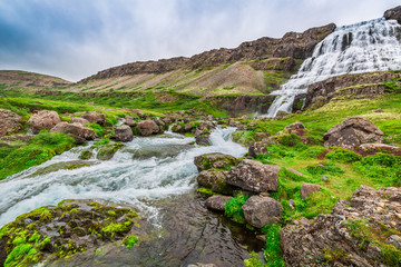 Fototapeta na wymiar Waterfall flowing into a valley in Iceland