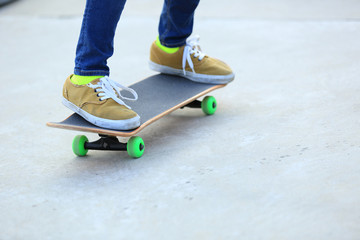 skateboarding legs at skatepark