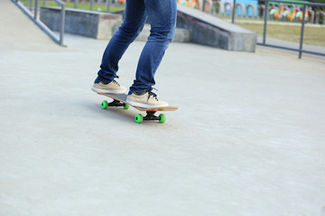 skateboarding legs at skatepark