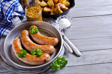 Grilled sausages with potatoes
